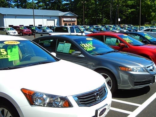 Rows of clean cars for sale on a dealership lot