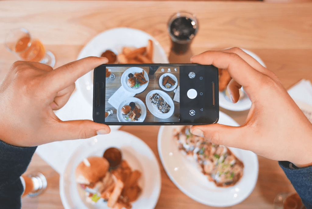 Restaurant customer taking a photo of their order.