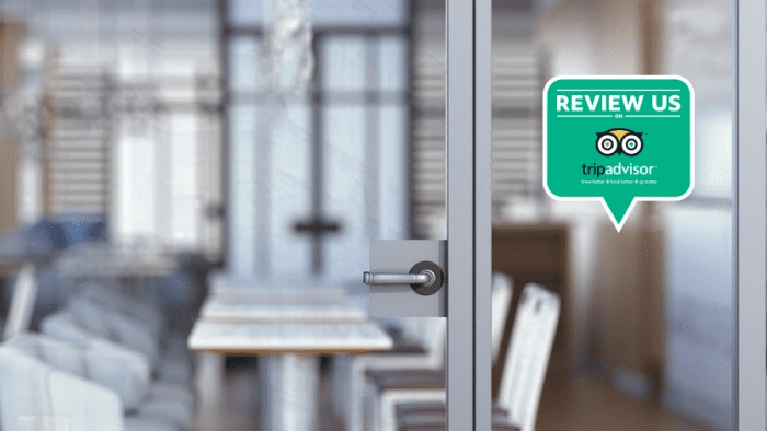 Image of sticker on window requesting TripAdvisor reviews
