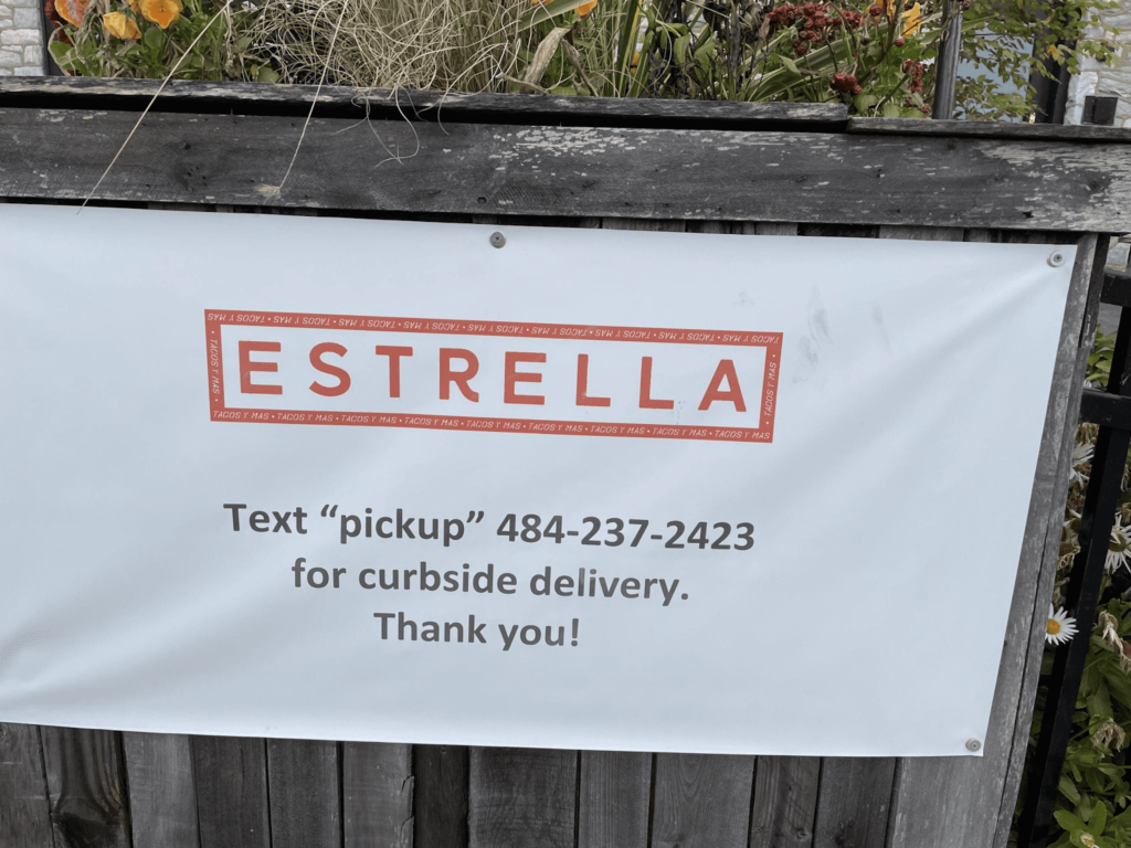 A banner showing customers how to use text messages when picking up their order
