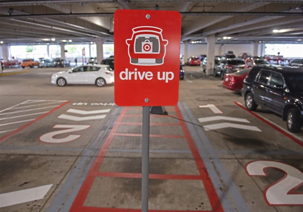 A drive-up curbside delivery sign marking a parking space