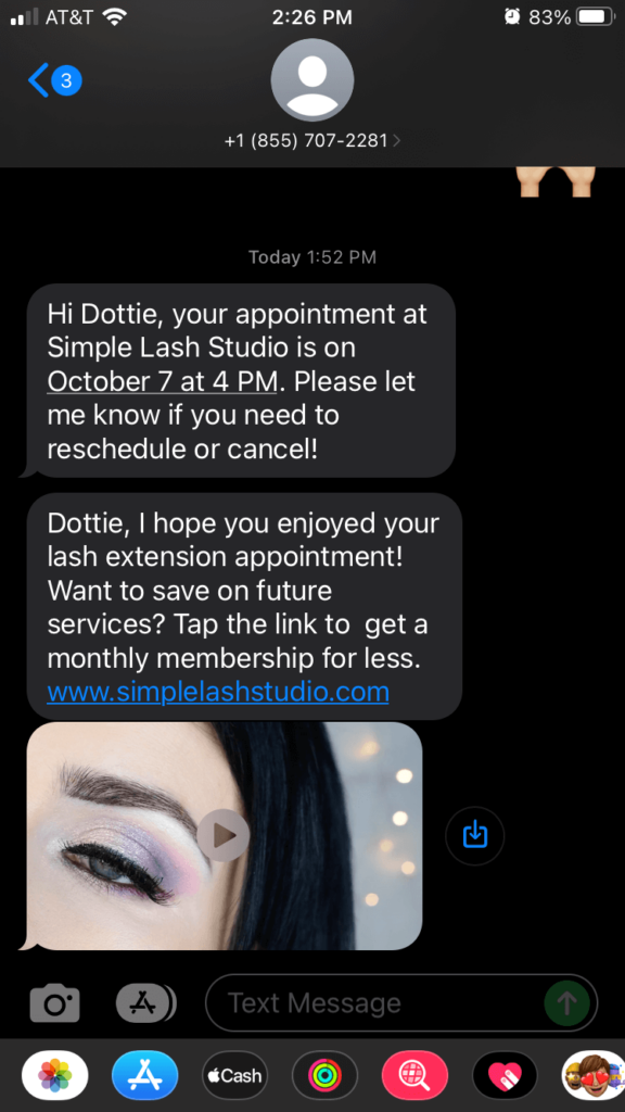 Text message from a lash studio business that includes a discount on future services and a video explainer