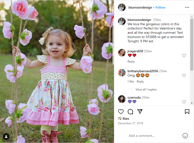 An Instagram post by blumoondesign featuring a picture of a little girl in a pink and cream dress with patterns and florals. The caption encourages the reader to text “blumoon” to 555888 to get a reminder of the dress’s release.
